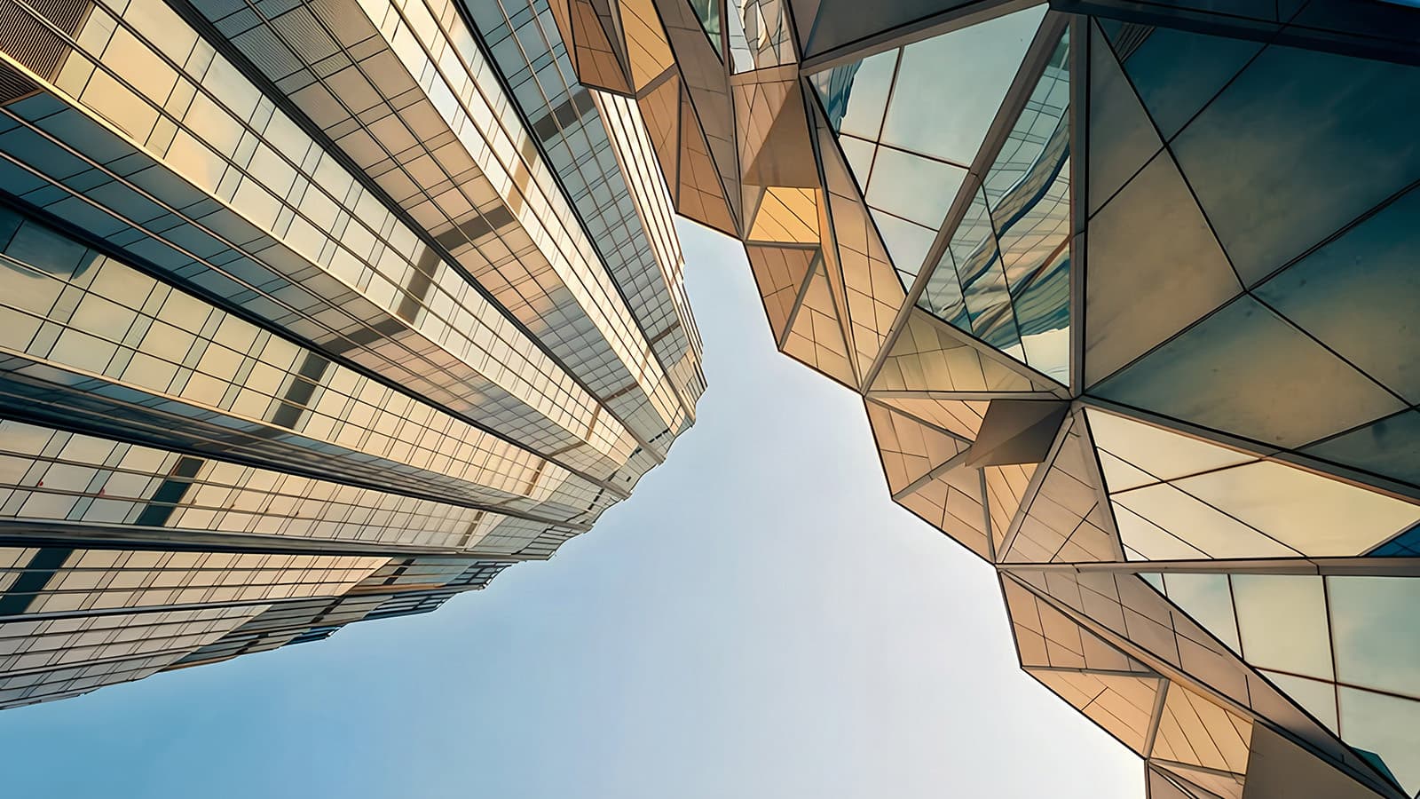 Two buildings converging, representing the mergers and acquisitions concept.