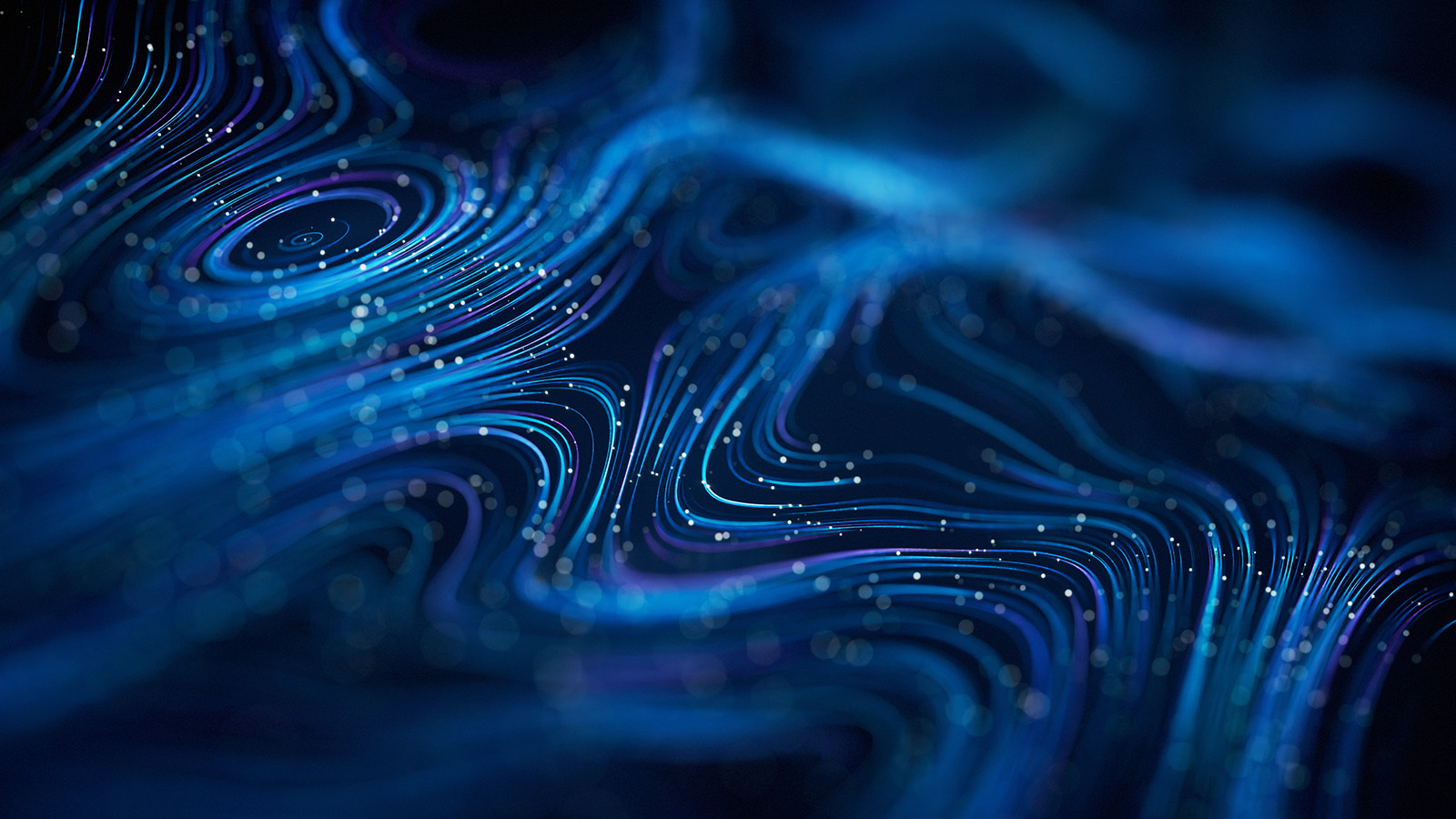 Curved data lines in blue and purple with a shallow depth of field, representing the concept of technology (broadly) or a computer network.