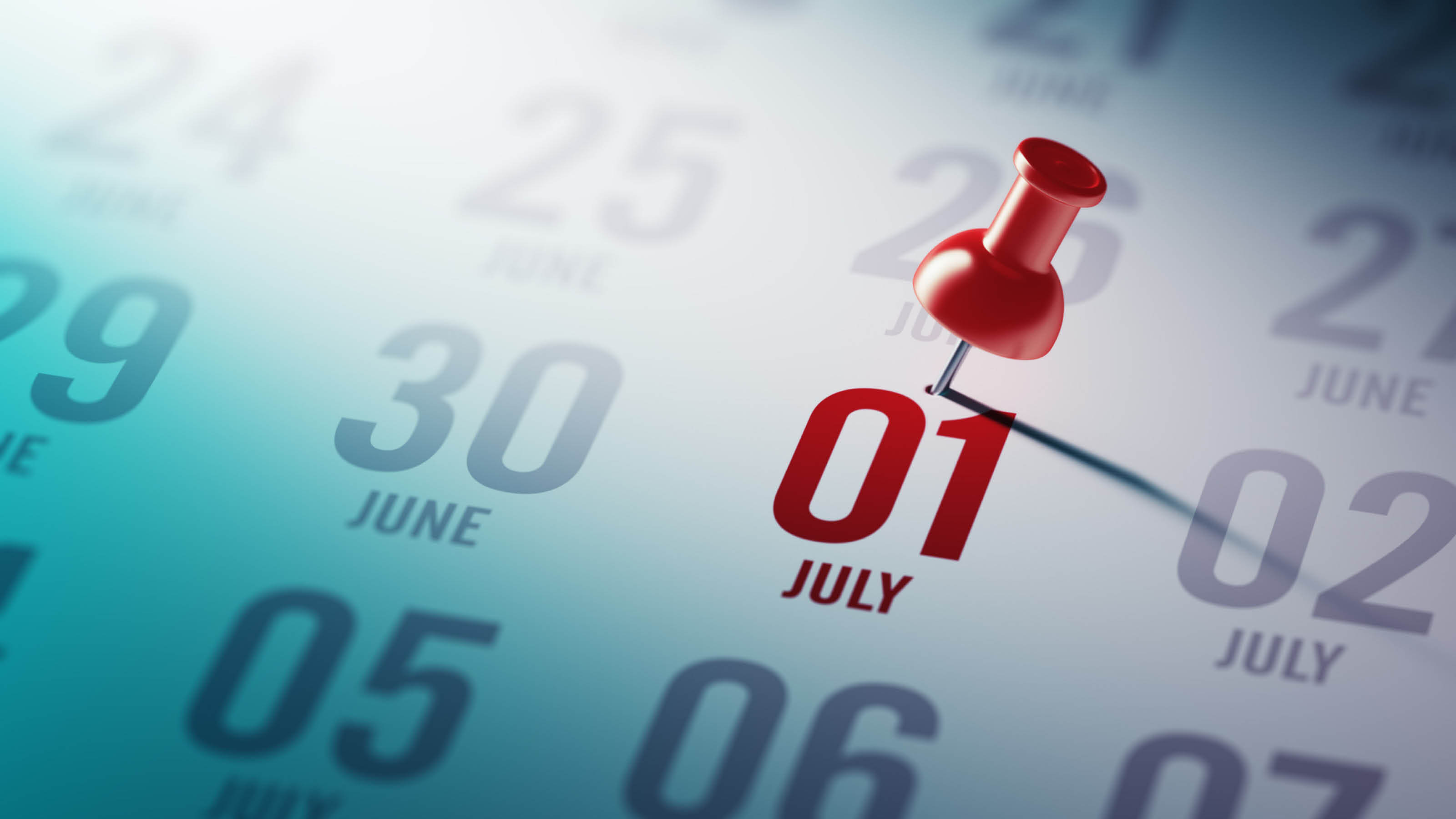 Calendar with 1 July selected. 1 July is in red text and with a push-pin/tack in it. Other dates are in grey.
